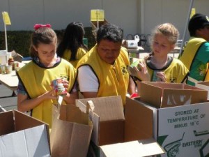 Mormon Helping Hands help prepare food supplies to be distributed to those in need.
